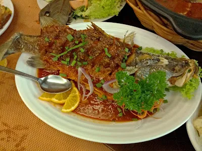 Fried whole fish with garnish