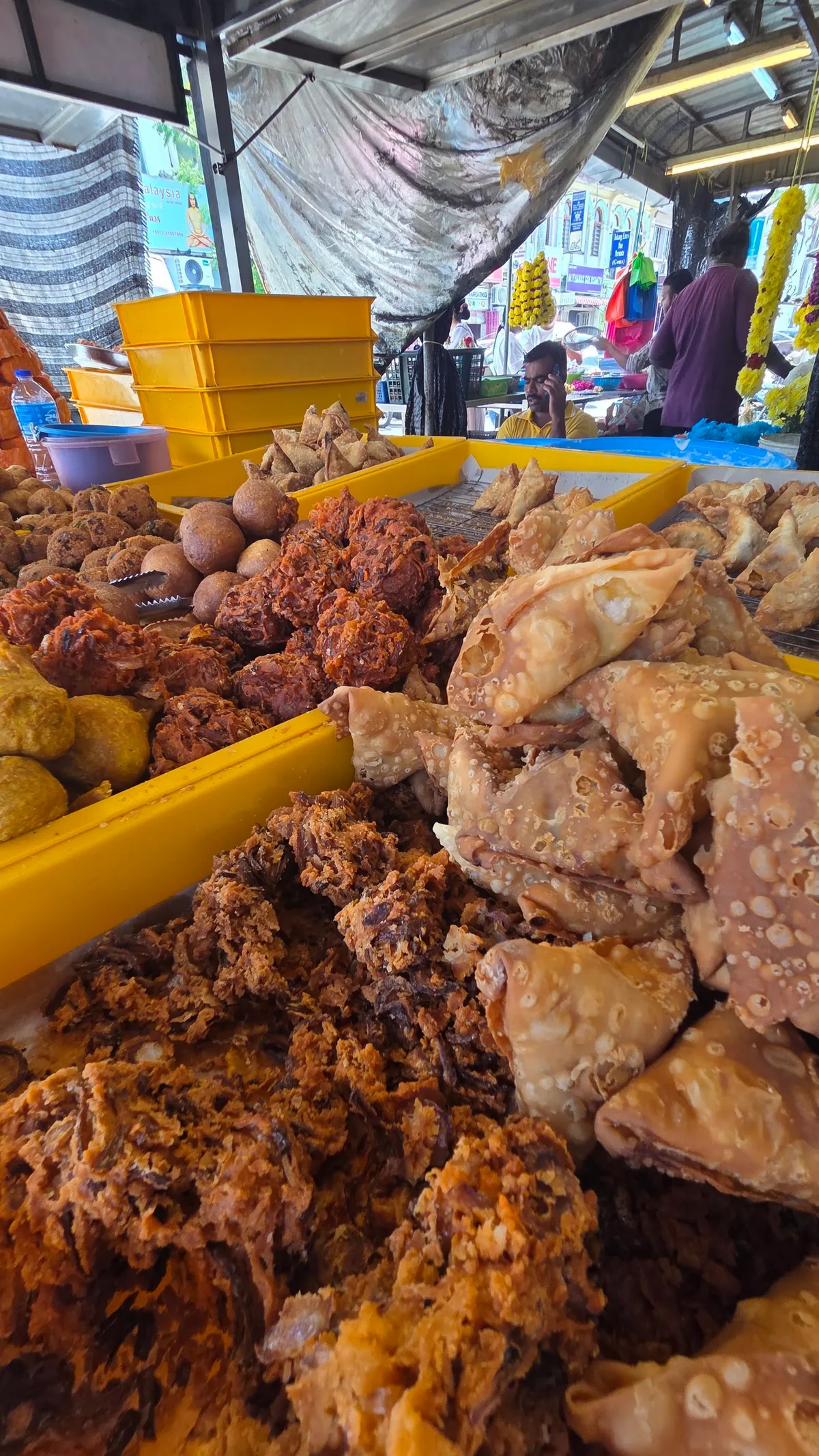 Trays of samosas and fritters on the stall