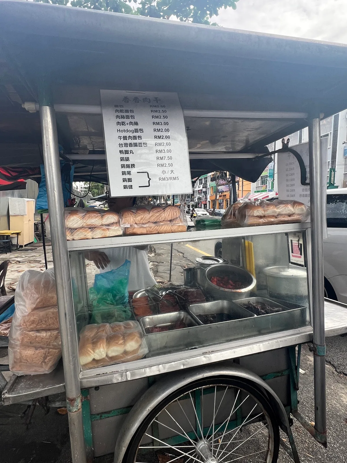The roadside cart with bread and the price list