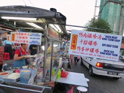 Kochabi duck meat koay teow signboard with menu and prices