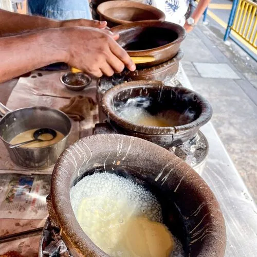 Apom cooking in claypots