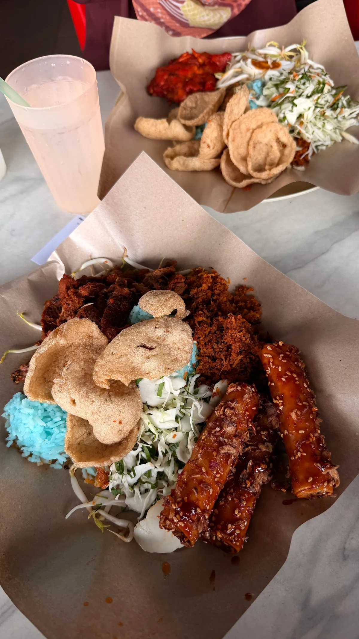 Nasi kerabu with grilled chicken