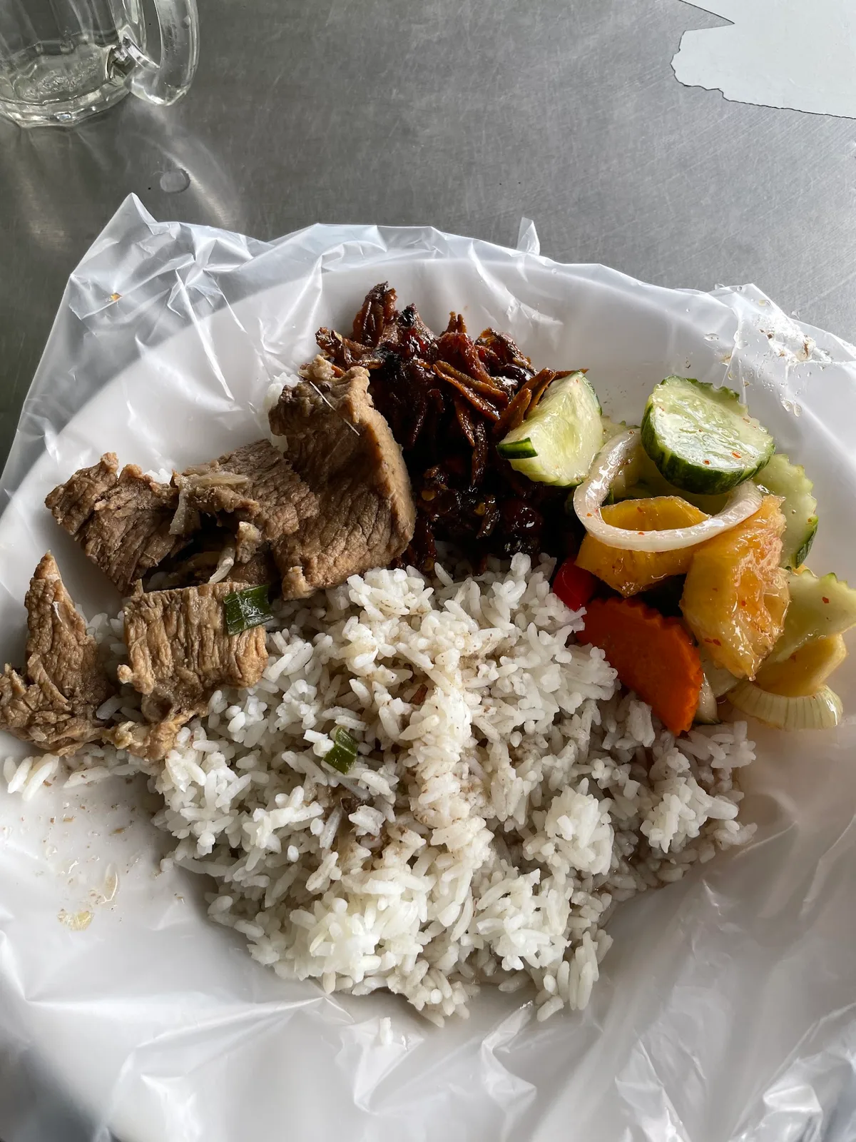Nasi campur with beef, cucumber and acar