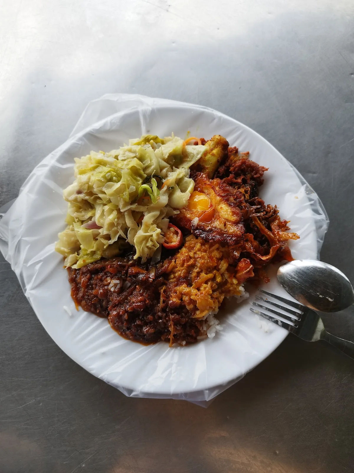 Nasi campur with sambal and stir-fried vegetables