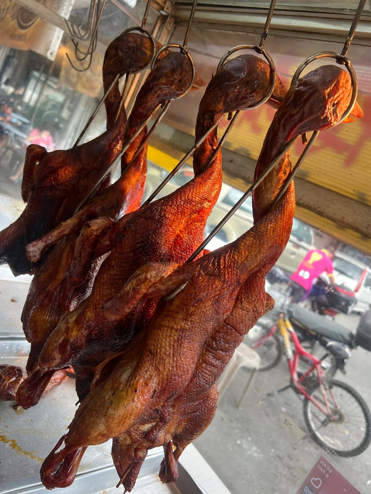 Roast ducks hanging at the stall