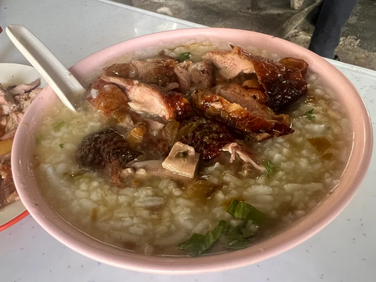 Duck porridge topped with roast duck