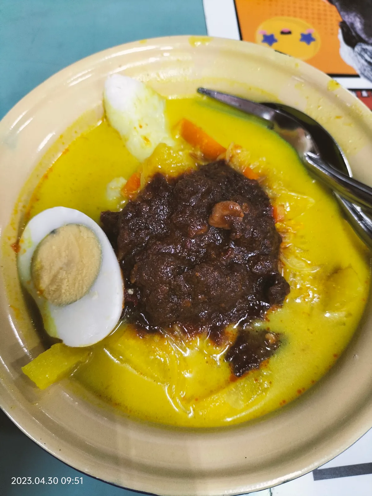 Lontong with beef rendang and egg