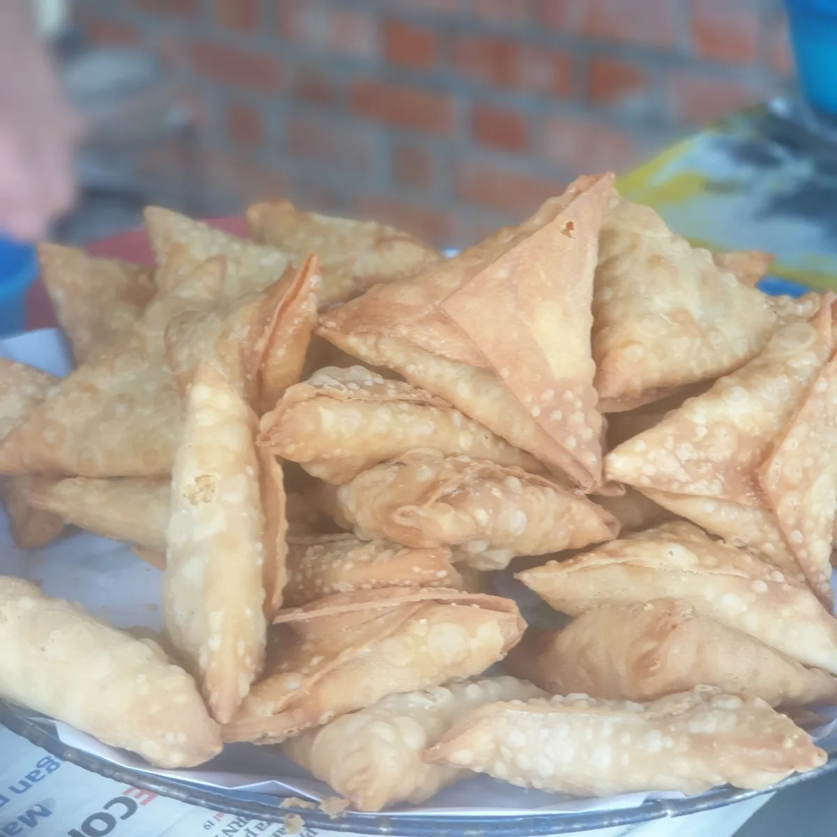 Samosas piled on the cart