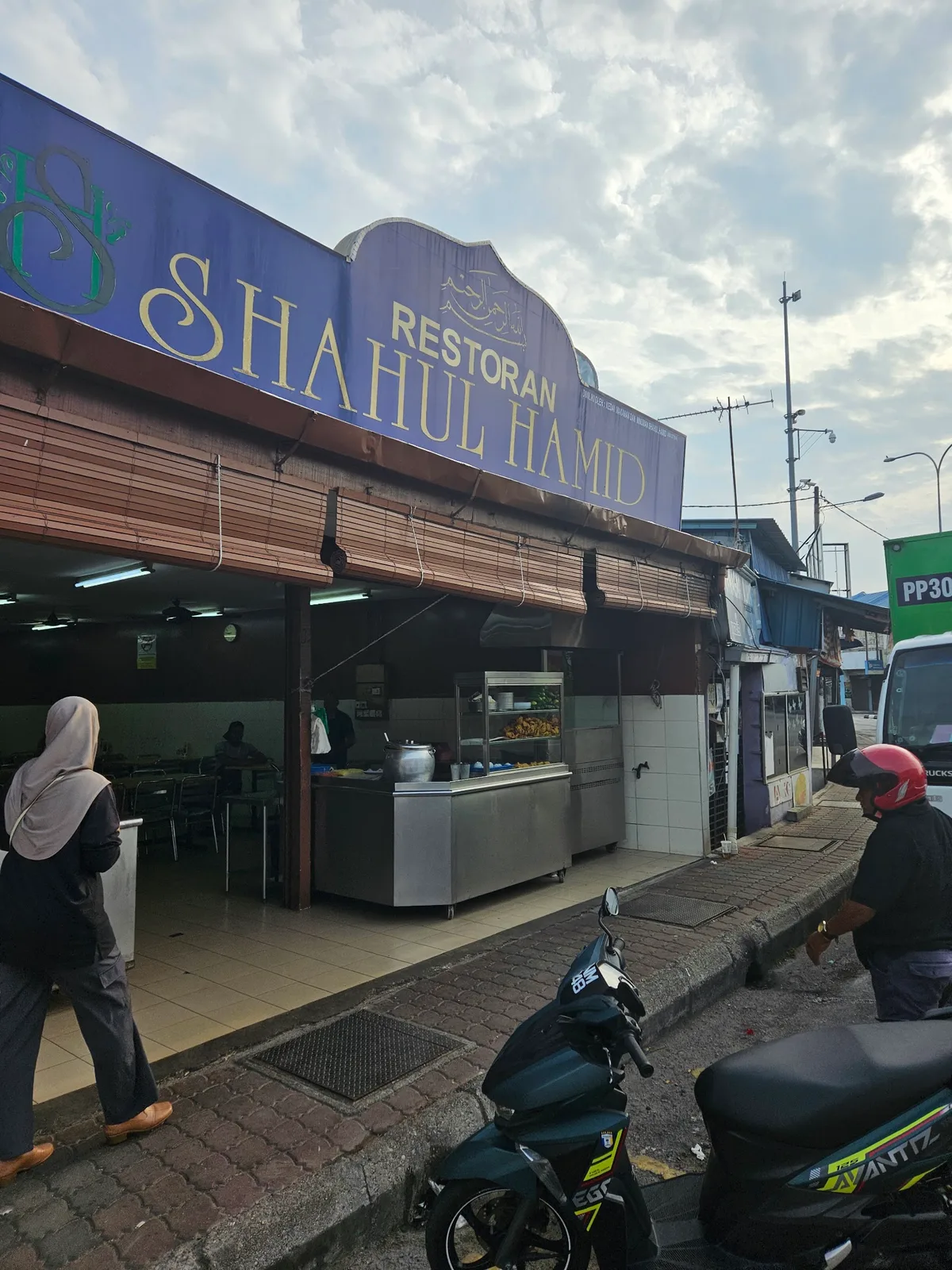 The Restoran Shahul Hamid shopfront in Kepala Batas, its signboard above the open front
