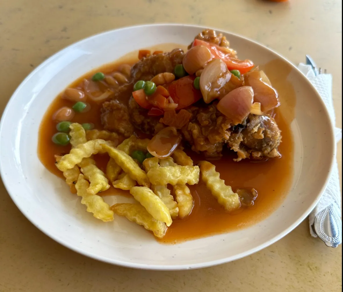 Chicken chop with gravy and crinkle-cut chips