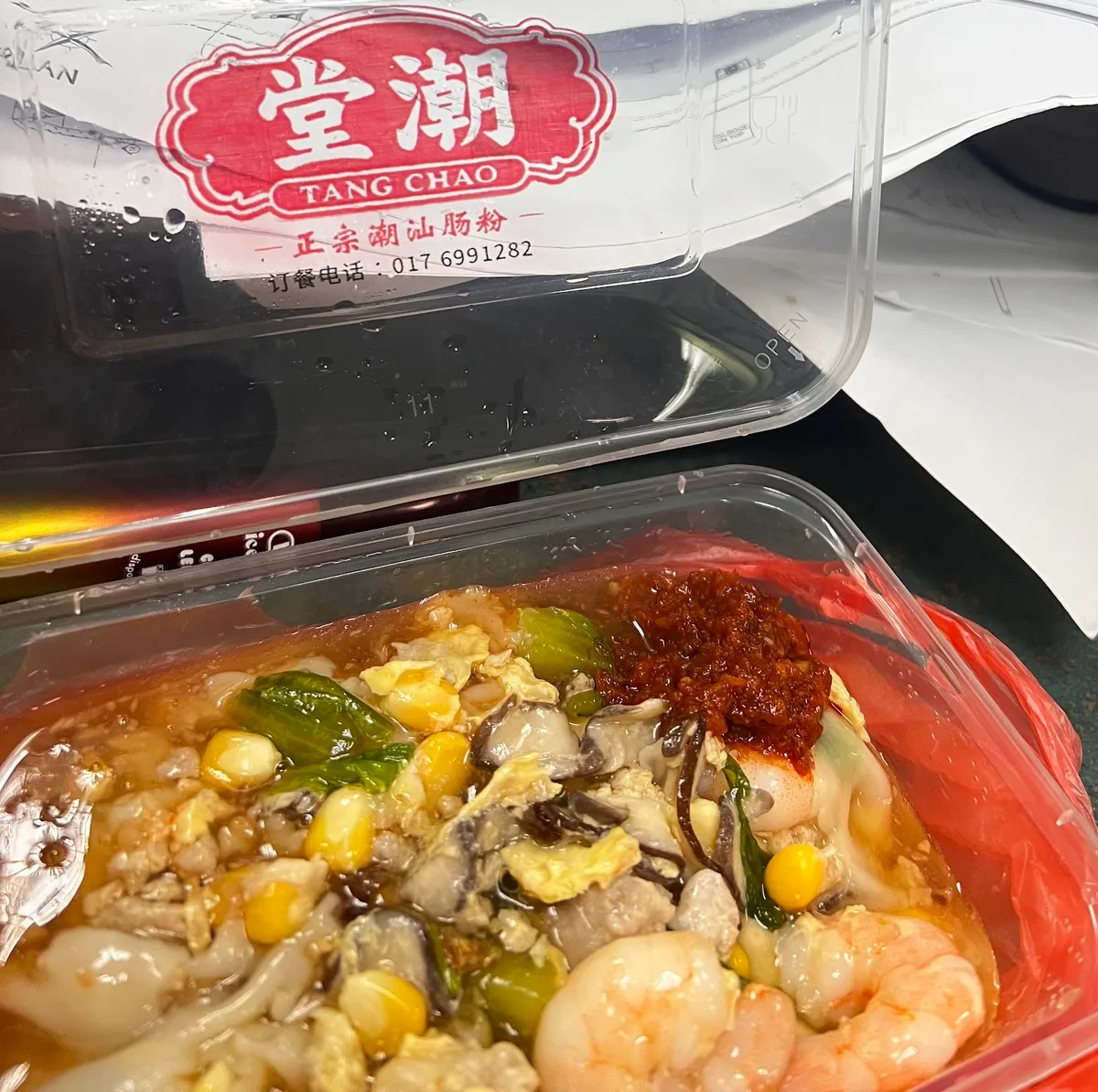 Takeaway box with the Tang Chao label
