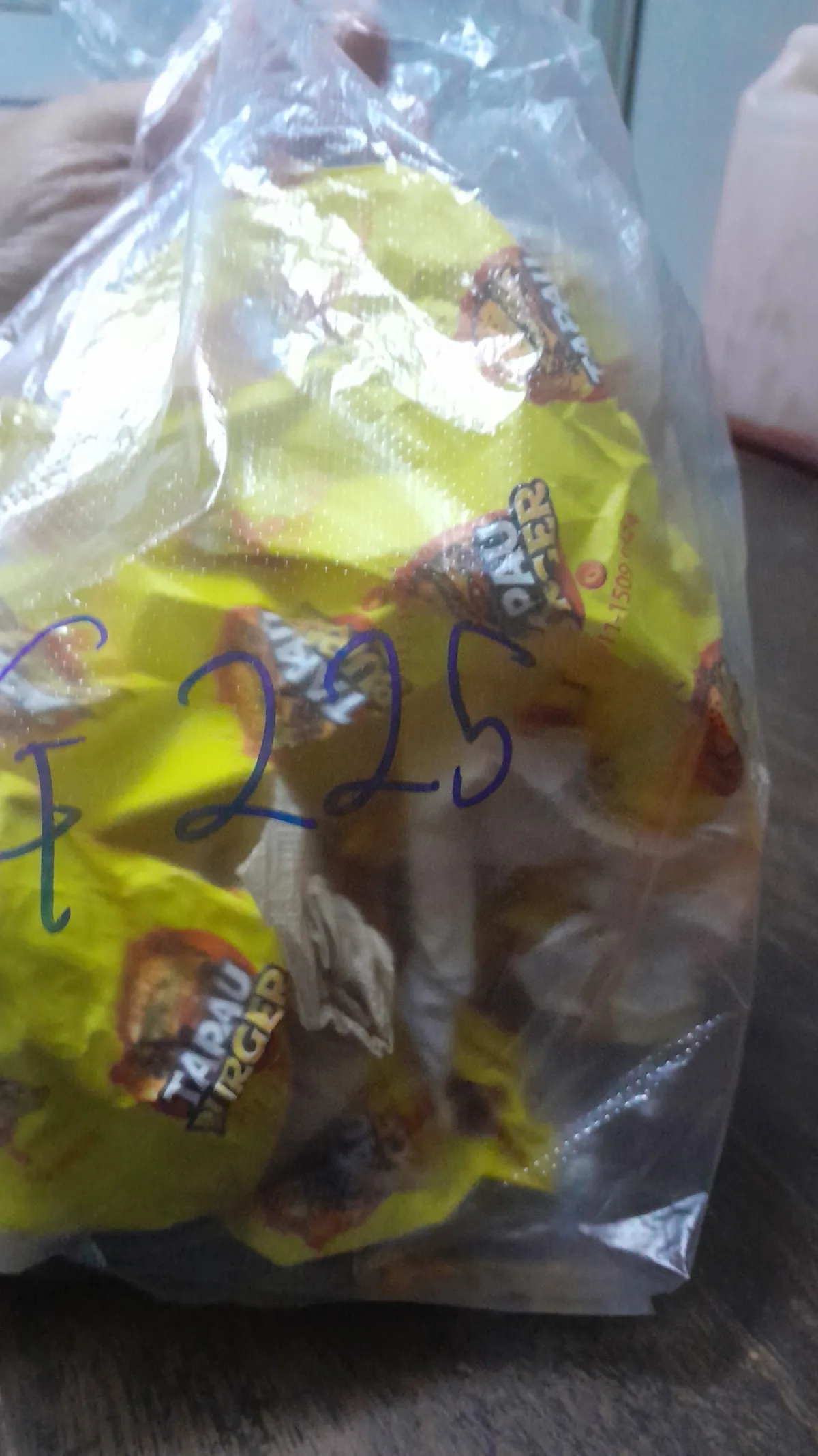 A bag of wrapped burgers to go