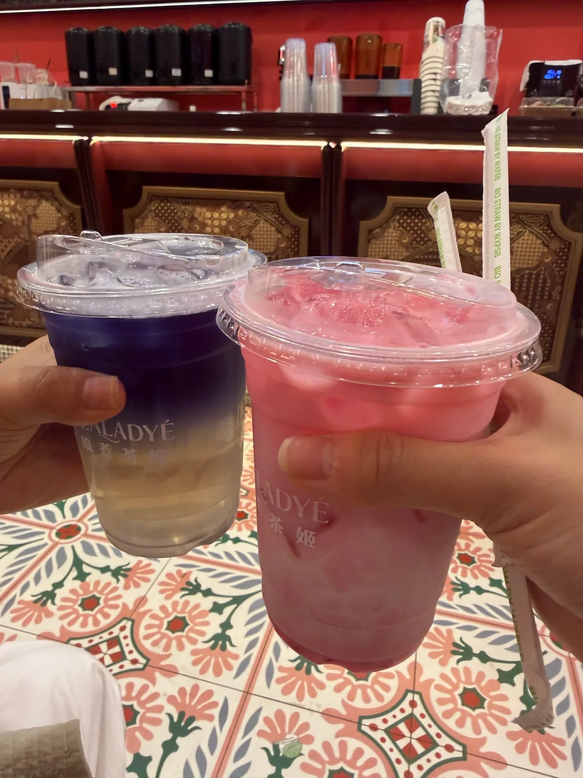 Blue pea and rose drinks side by side