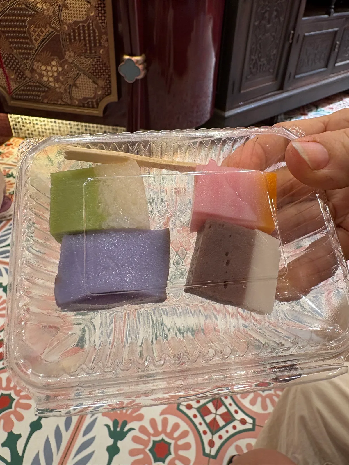 Rainbow nyonya kueh slices in the tray