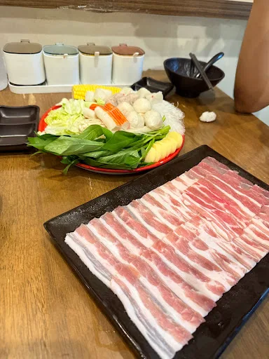 Tem Xim Charcoal Mookata — signature dish