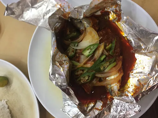 The Myth Curry Fish Head — signature dish