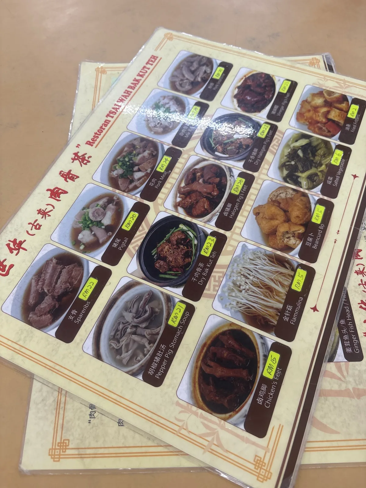 Menu card headed Restoran Tsai Wah Bak Kut Teh, with dishes and prices