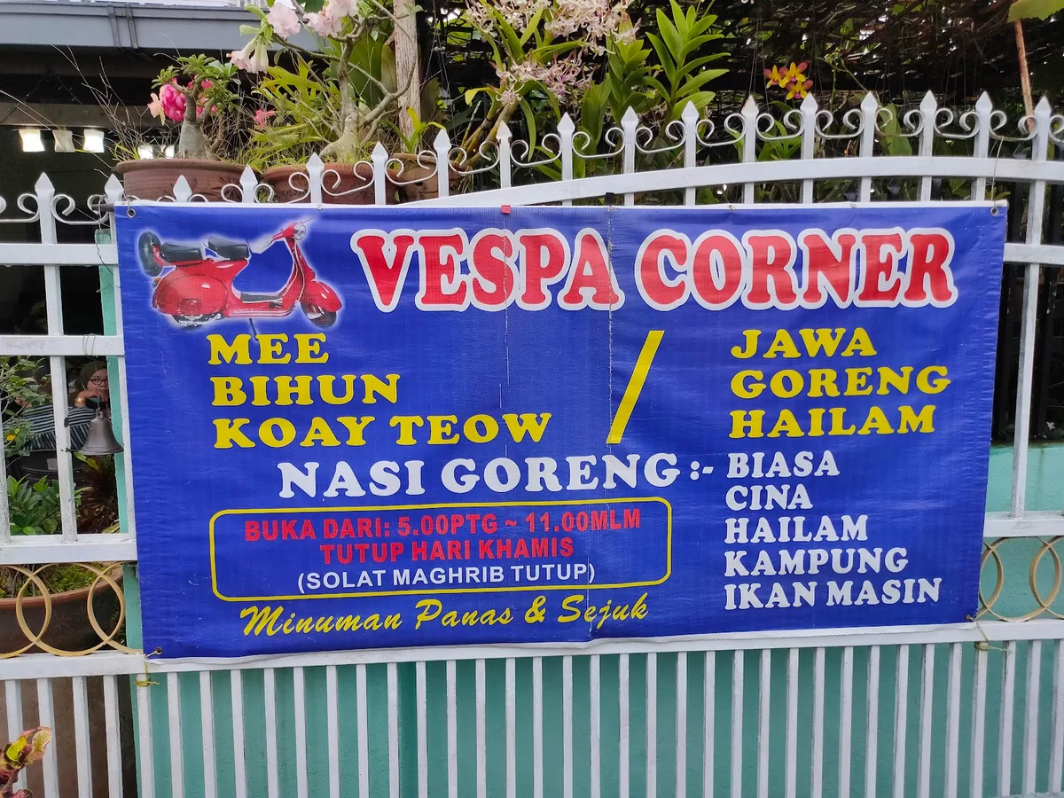 Vespa Corner banner on the gate: mee, bihun, koay teow, jawa, goreng, hailam