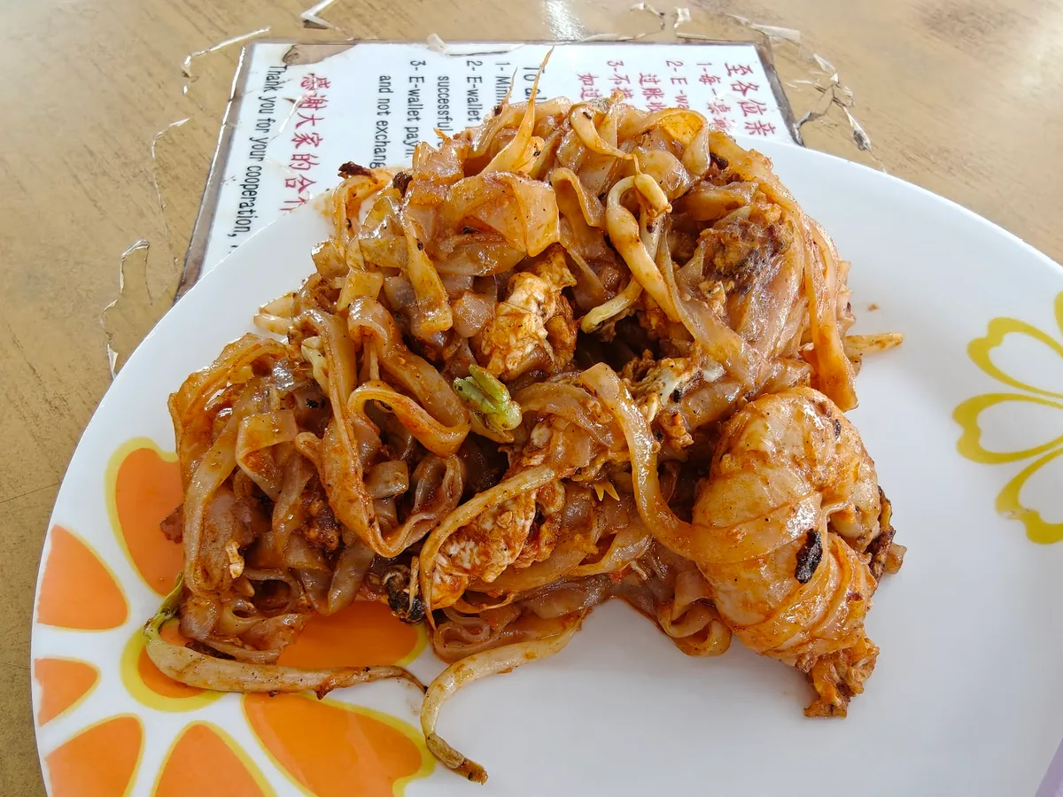 Char koay teow piled to one side of the plate