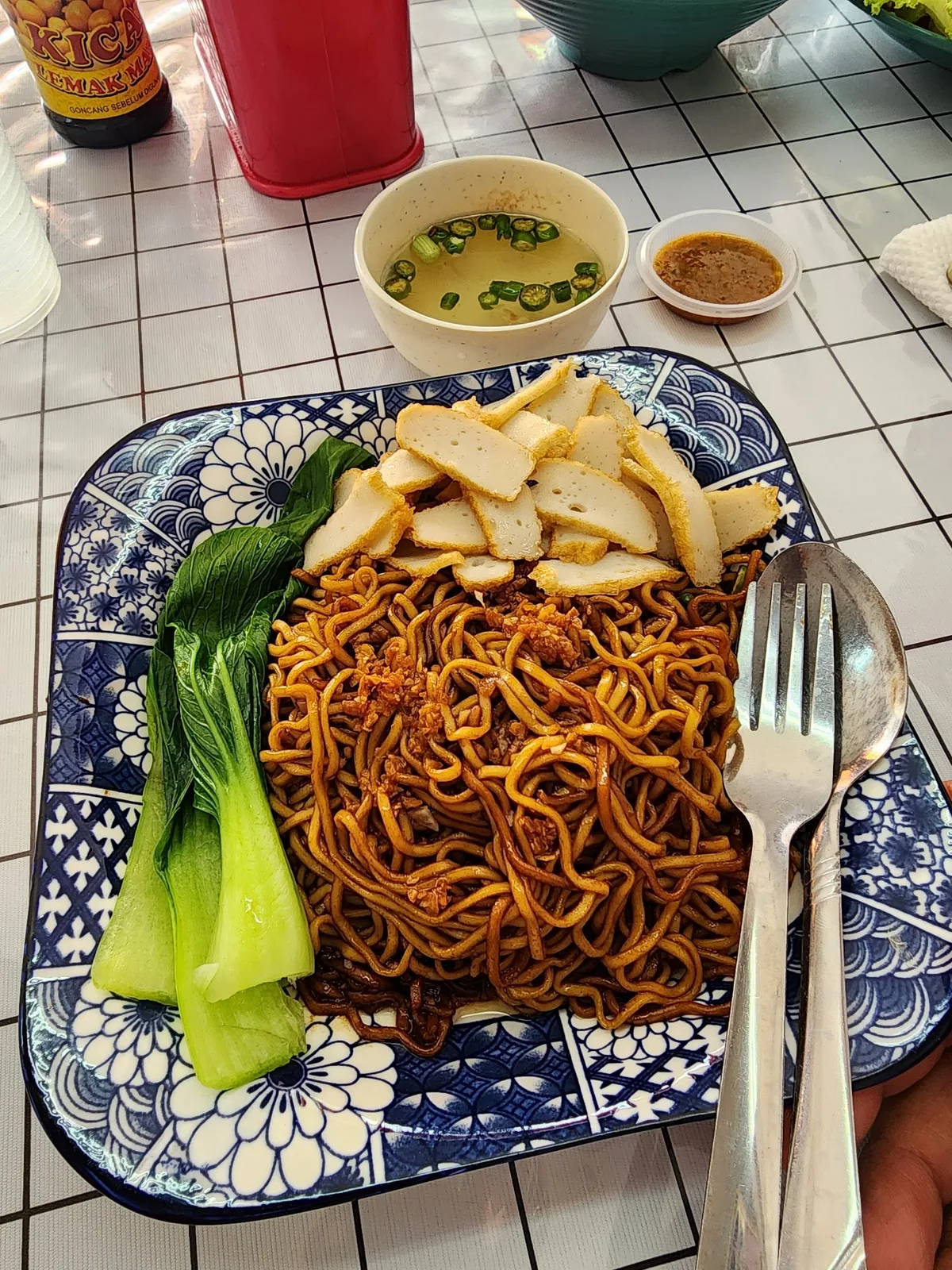 Mee kicap with fishcake and greens