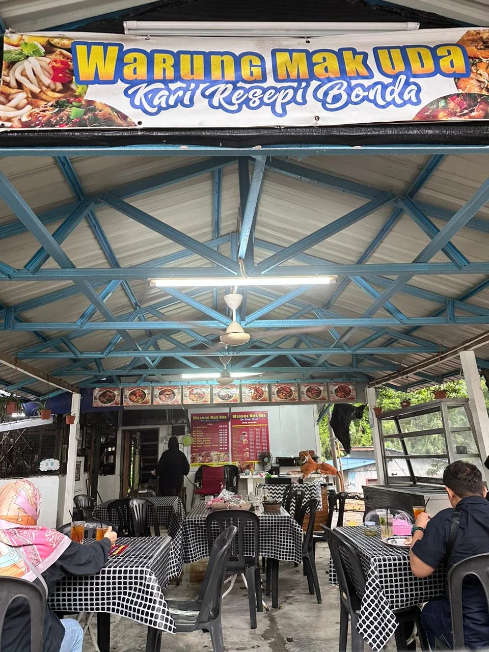 Warung Mak Uda signboard over the dining shed