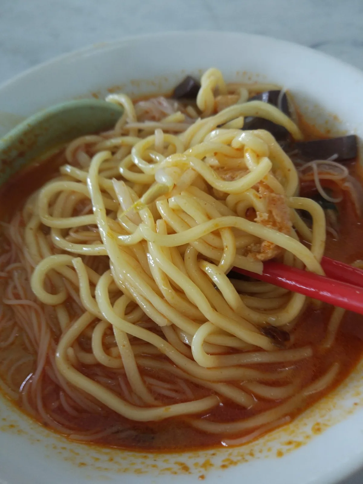 Hokkien mee yellow noodles and bee hoon lifted from the broth