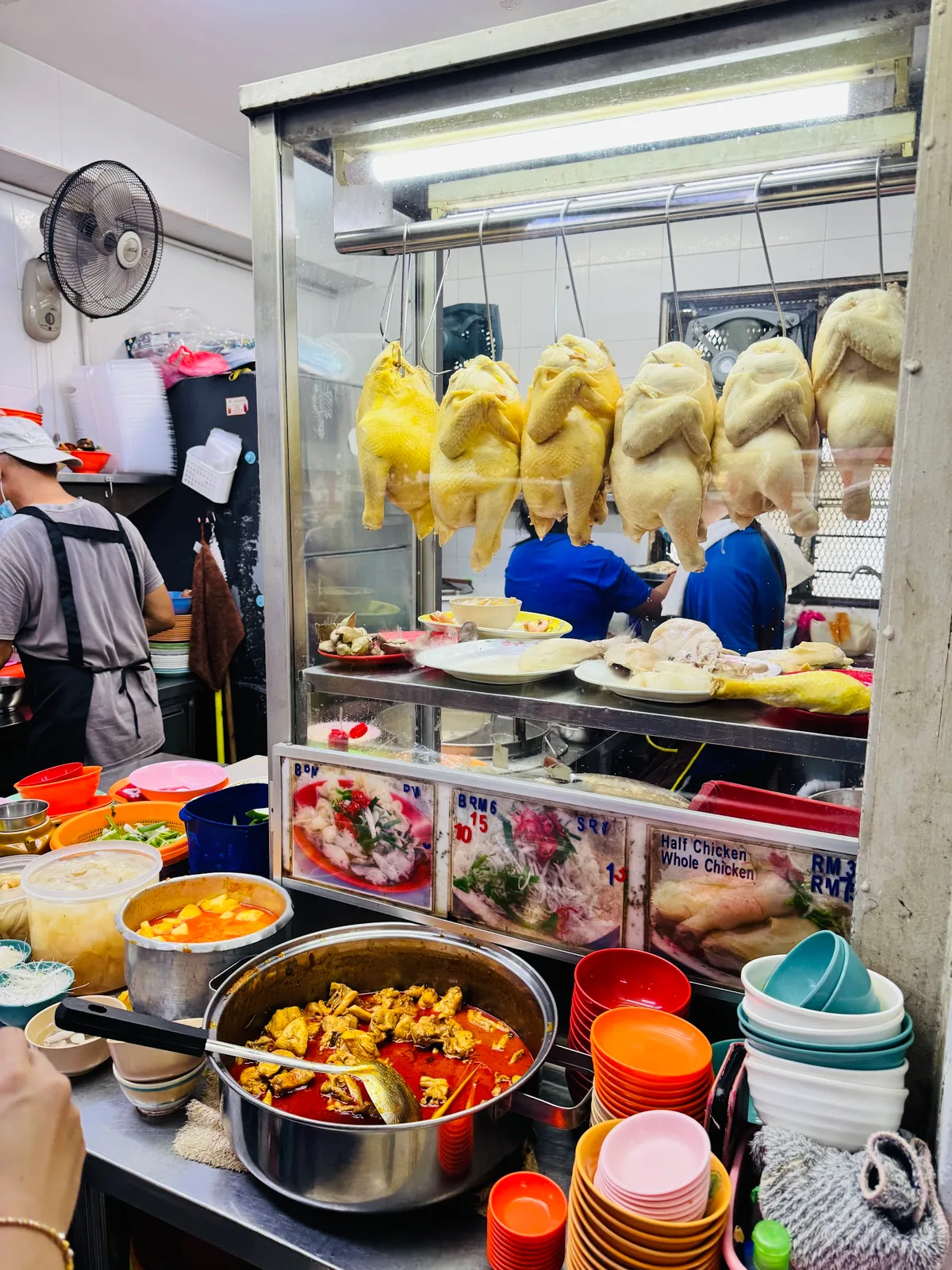 Stall with hanging chickens